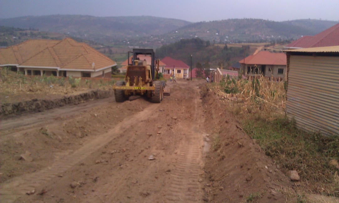 road-construction-placeholder — grader shaping a gravel road platform