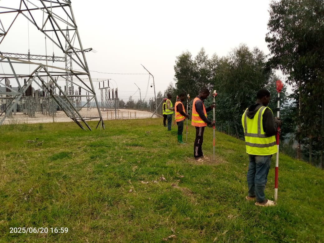 substation-placeholder — survey crew working beside a high-voltage substation and pylon